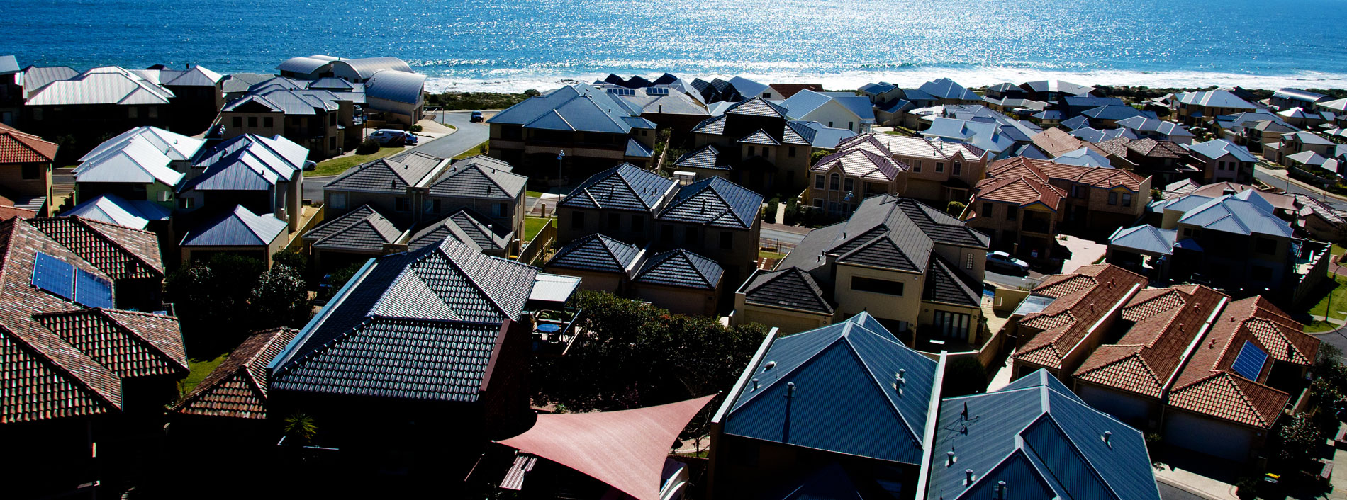 View looking over houses next to ocean