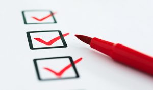 check boxes with red ticks and red texta